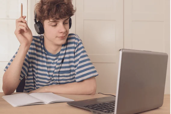 A student is studying on his laptop